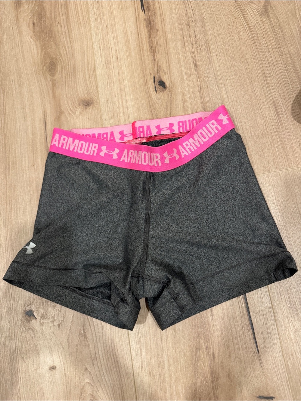 Under Armour Women's Dark Gray Athletic Shorts with Pink Logo Waistband